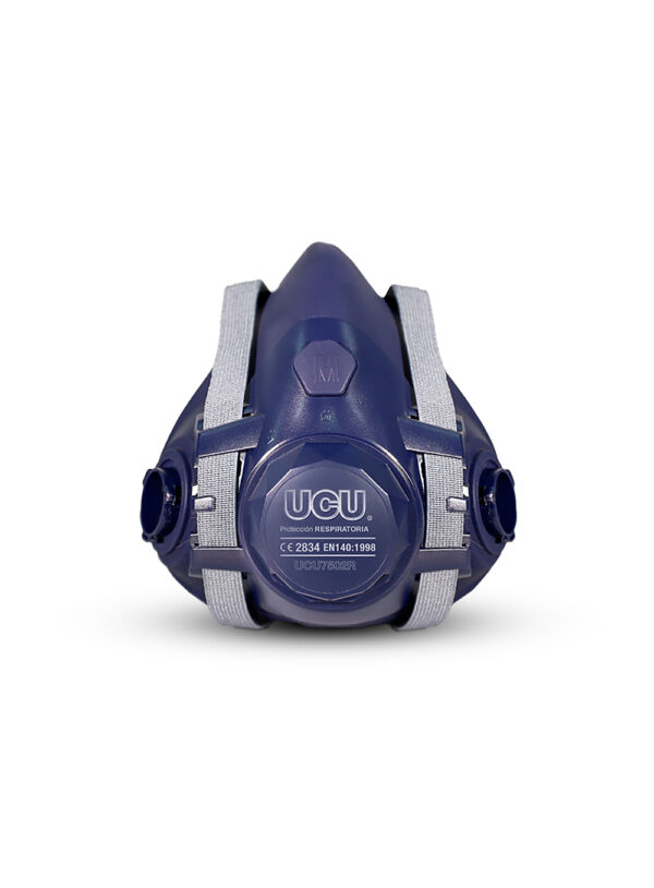 Mascara Medio Rostro Silicona Vista frontal de catálogo de la máscara de medio rostro de silicona azul UCU7502RS, destacando el arnés de sujeción gris claro y las válvulas laterales de conexión bayoneta.